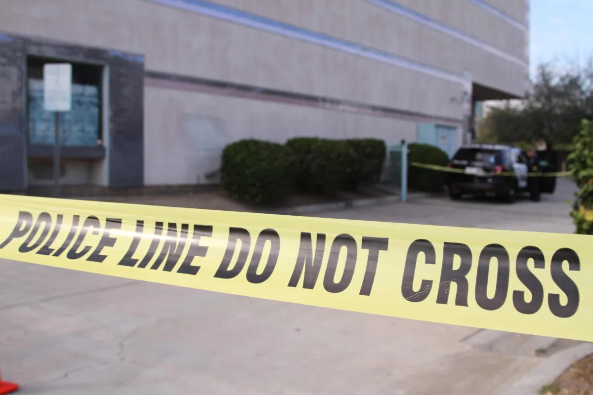 Crime scene tape is seen outside of the U.S.-based Chinese-language newspaper China Press' office after a shooting death in Alhambra, Calif., on Nov. 16, 2018. (Linda Jiang/The Epoch Times)