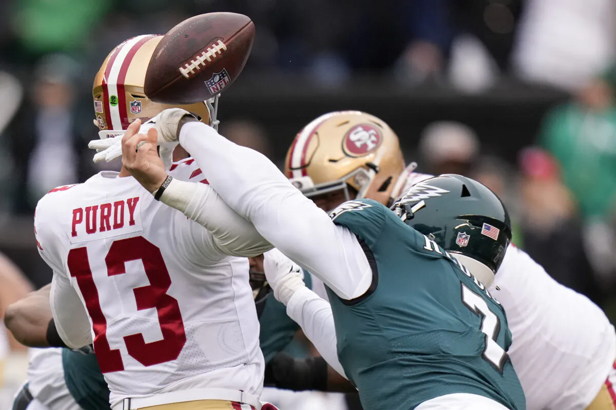 Philadelphia Eagles linebacker Haason Reddick (R) causes a fumble by San Francisco 49ers quarterback Brock Purdy during the first half of the NFC Championship NFL football game between the Philadelphia Eagles and the San Francisco 49ers in Philadelphia on Jan. 29, 2023. (Seth Wenig/AP Photo)