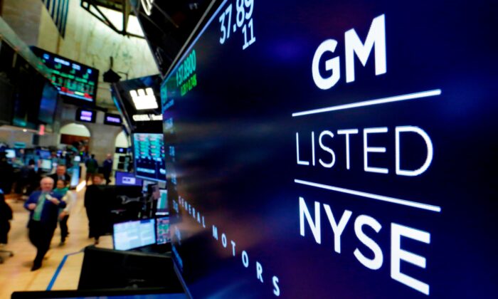 The logo for General Motors appears above a trading post on the floor of the New York Stock Exchange on Jan. 31, 2023. (Richard Drew/AP Photo)