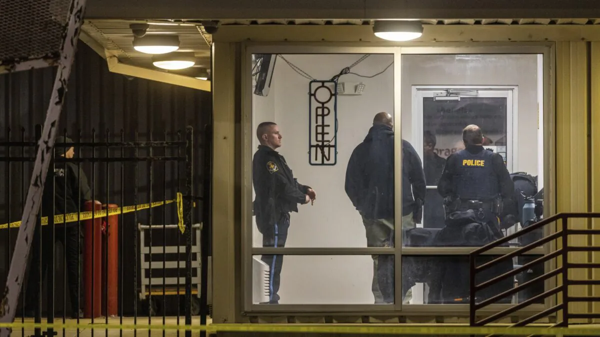 Omaha police investigate the scene where two Omaha Police officers were shot and injured and a third person was killed during an attempted burglary at a storage facility on Jan. 30, 2023. (Chris Machian/Omaha World-Herald via AP)