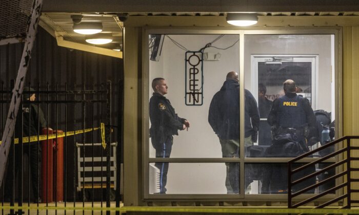 Omaha police investigate the scene where two Omaha Police officers were shot and injured and a third person was killed during an attempted burglary at a storage facility on Jan. 30, 2023. (Chris Machian/Omaha World-Herald via AP)