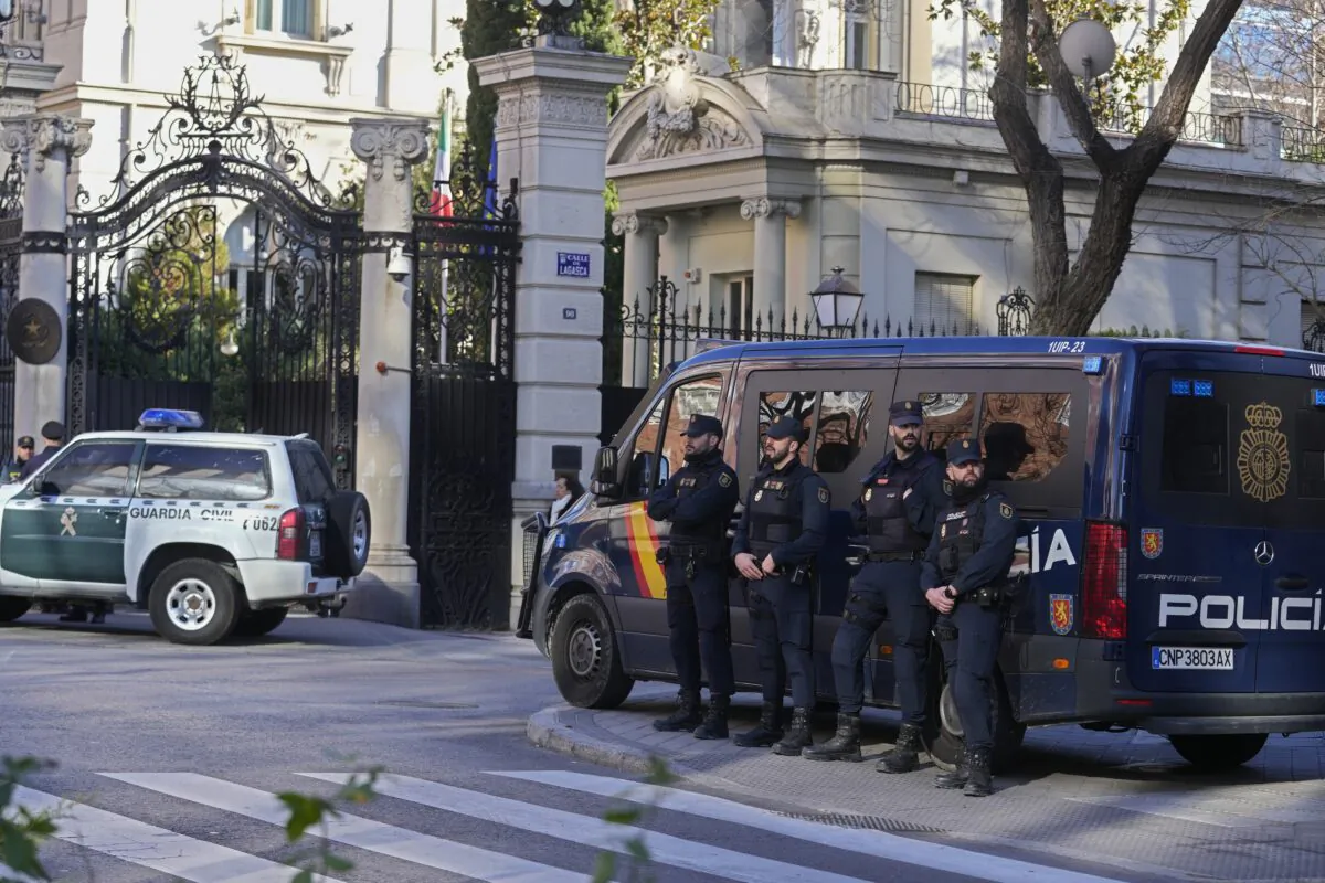 Spanish national police stand in front of the Italian embassy in Madrid on Jan. 31, 2023. (Paul White/AP Photo)
