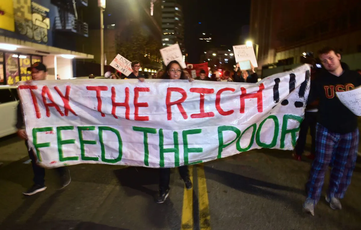 Demonstrators protest tax reform legislation in Los Angeles on Dec. 4, 2017. (Frederic J. Brown/AFP via Getty Images)