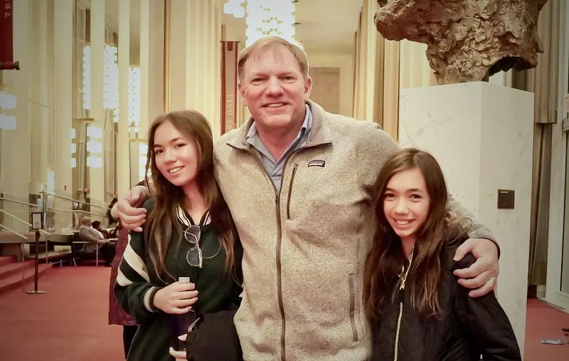 Filmmaker Jason Jones and his daughters attended Shen Yun Performing Arts at The Kennedy Center Opera House, on Jan. 28, 2023. (Terri Wu/The Epoch Times)
