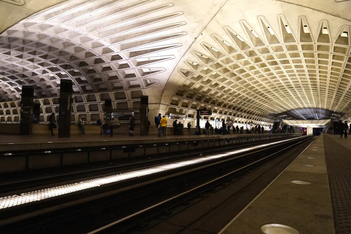 People waiting for the subway train at a Metro station in Washington on Jan. 6, 2022. (Mariam Zuhaib/AP Photo)