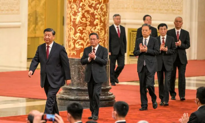 China's President Xi Jinping (L) walks with  members of the Chinese Communist Party's Politburo Standing Committee as they meet the media in the Great Hall of the People in Beijing on October 23, 2022. (Wang Zhao/AFP via Getty Images)