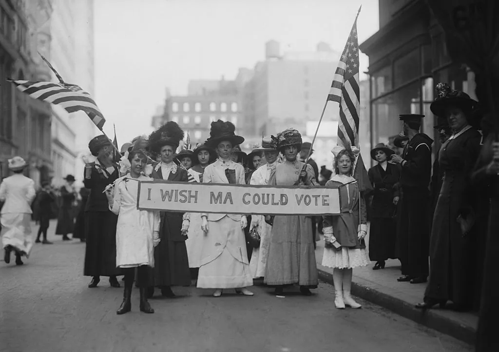 A group of Women's Suffrage activists march in a parade carrying a banner reading "I Wish Ma Could Vote" circa 1913. (FPG/Archive Photos/Getty Images)