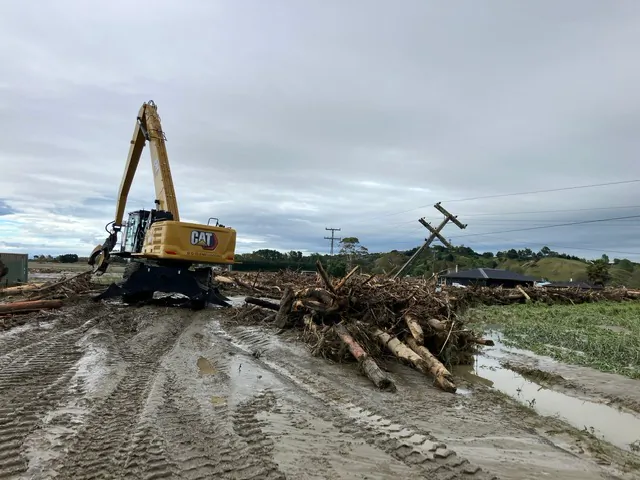 Cleaning up the logs that rushed down Esk Valley. (Courtesy of Ashley Church)