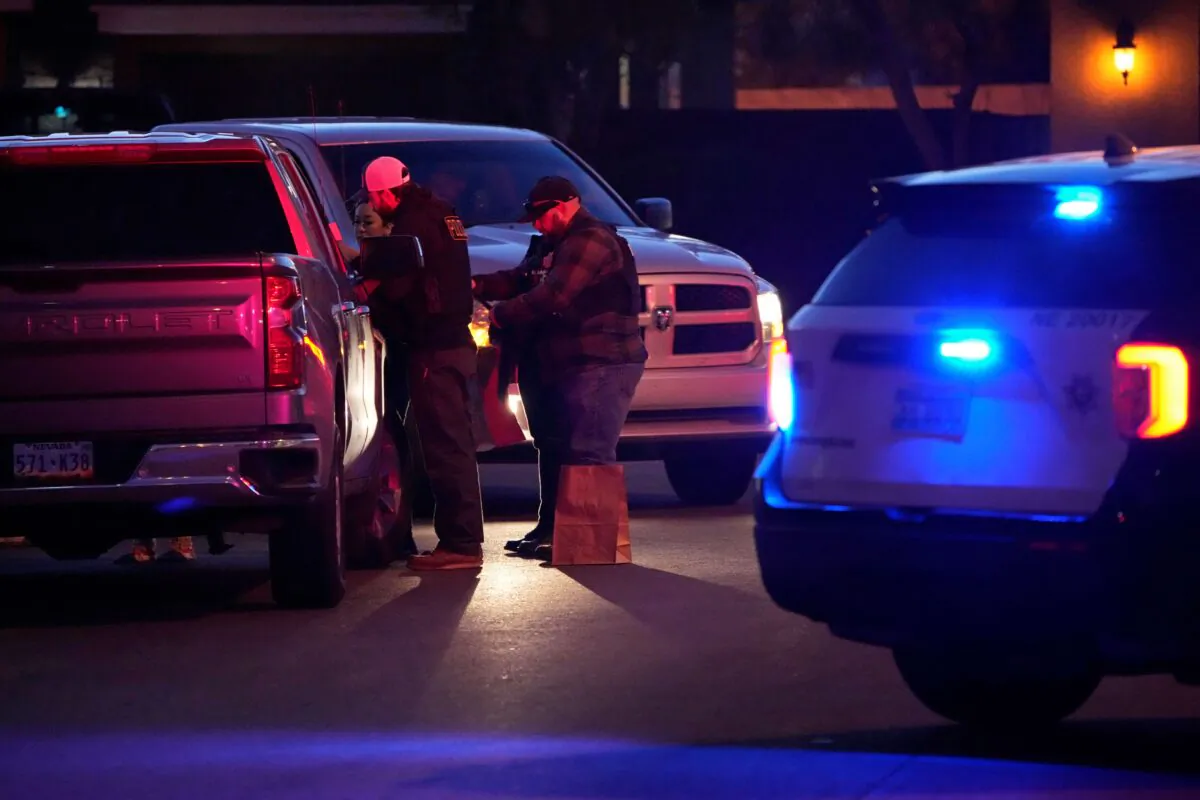 Las Vegas police work near the home of former actor Nathan Lee Chasing His Horse, who goes by Nathan Chasing Horse in North Las Vegas, on Jan. 31, 2023. (John Locher/AP Photo)