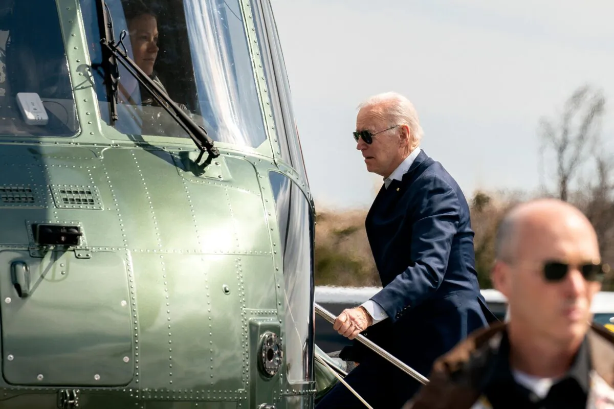 President Joe Biden boards Marine One at Gordons Pond in Rehoboth Beach, Del., on March 20, 2022. (Stefani Reynolds/AFP via Getty Images)