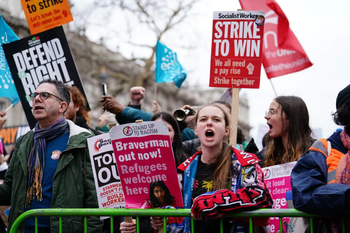 Striking members and supporters of the National Education Union (NEU) stage a protest on Whitehall, London, on Feb. 1, 2023. (Jordan Pettitt/PA Media)