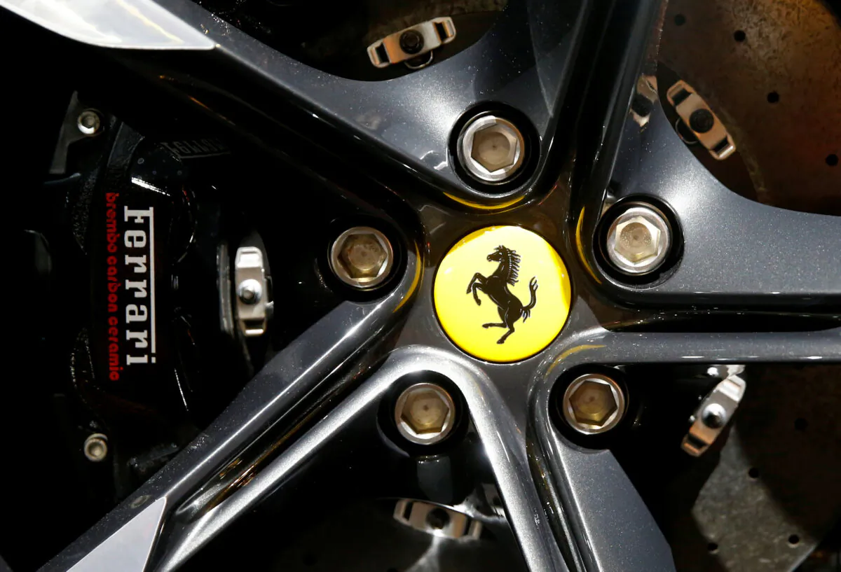 The company's logo on a wheel hub of a Ferrari Roma sports car during a media preview at the Auto Zurich Car Show in Zurich on Nov. 3, 2021. (Arnd Wiegmann/Reuters)