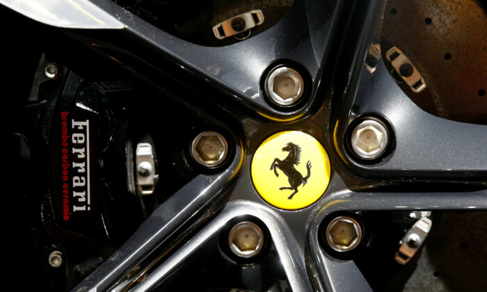The company's logo on a wheel hub of a Ferrari Roma sports car during a media preview at the Auto Zurich Car Show in Zurich on Nov. 3, 2021. (Arnd Wiegmann/Reuters)