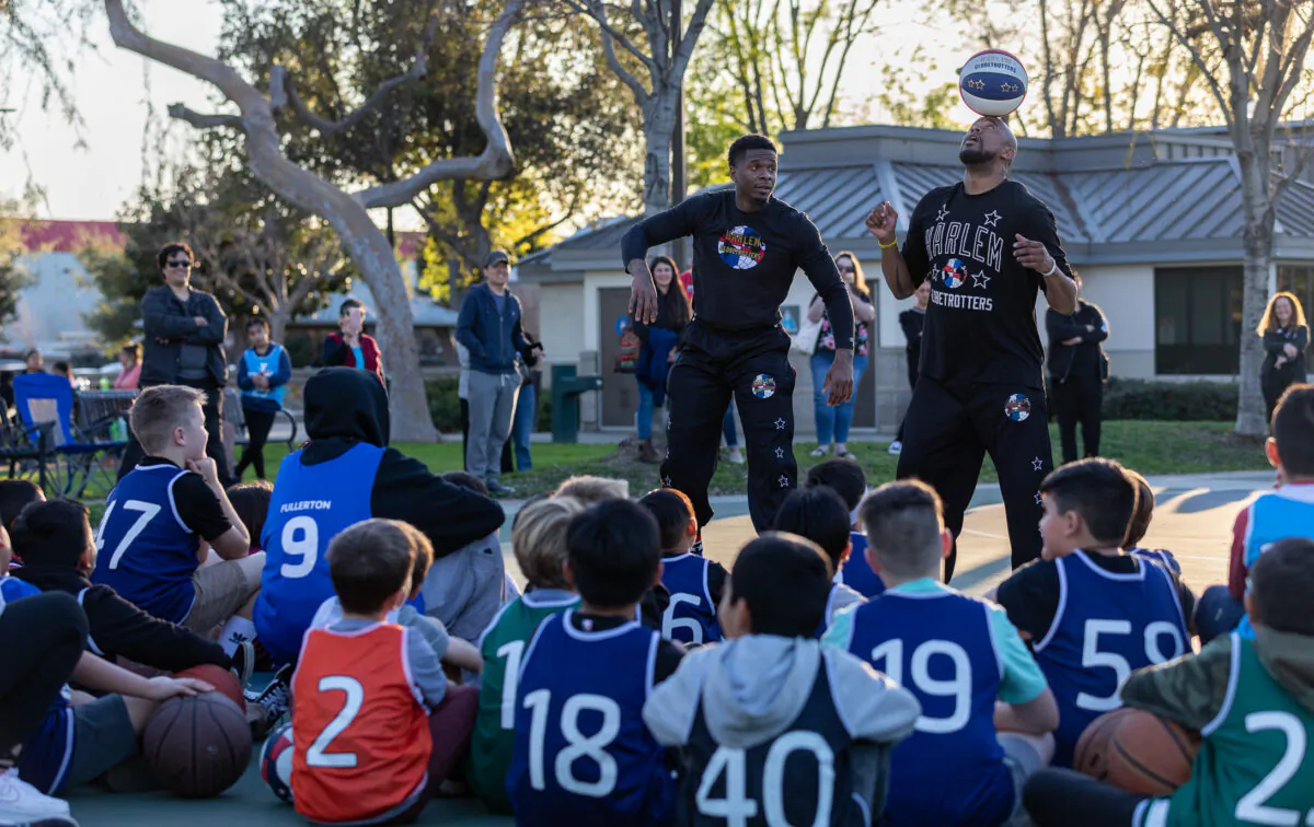 Children participate in a basketball training session with members of the Harlem Globetrotters, hosted by the YMCA of Orange County in Fullerton, Calif., on Feb. 1, 2023. (John Fredricks/The Epoch Times)