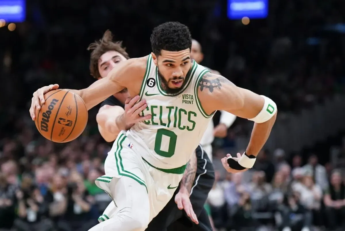 Boston Celtics forward Jayson Tatum (0) drives the ball against Brooklyn Nets forward Joe Harris (12) in the first quarter at TD Garden in Boston on Feb. 1, 2023. (David Butler II/USA TODAY Sports via Field Level Media)