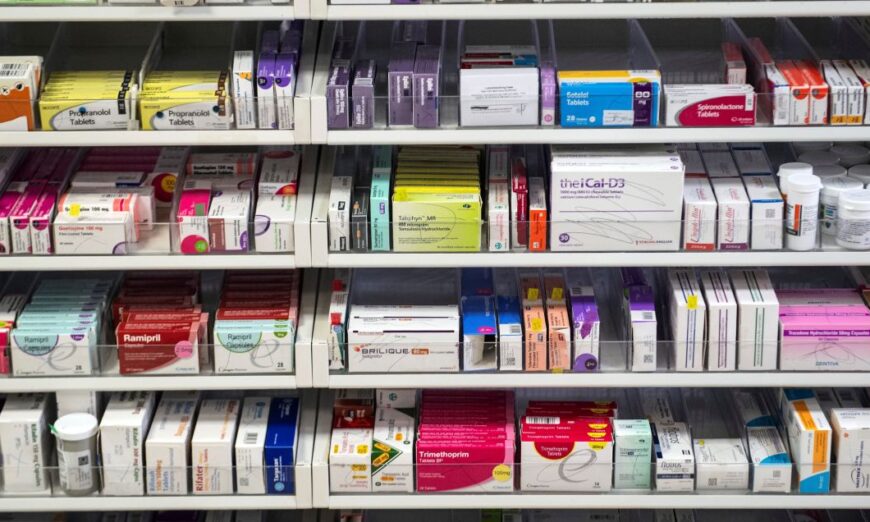 A file photo shows medications displayed on shelves. (Andy Buchanan/POOL/AFP via Getty Images)