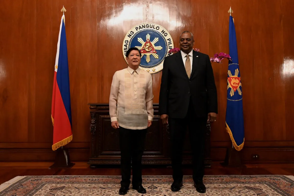 U.S. Secretary of Defense Lloyd James Austin III (R) poses for a photo with Philippine President Ferdinand Marcos Jr. during a courtesy call at the Malacanang Palace in Manila, Philippines, on Feb. 2, 2023. (Jamilah Sta Rosa-Pool/Getty Images)