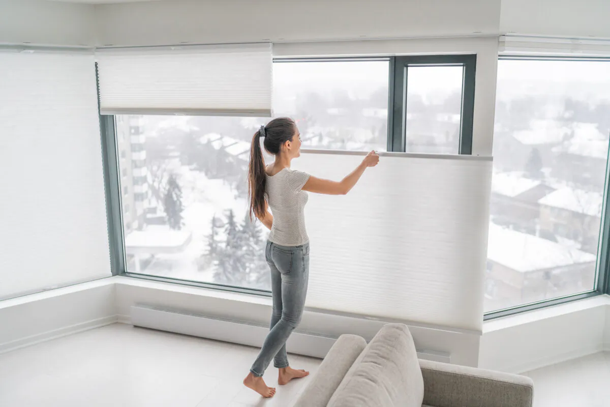 Open shades on a cold winter day to allow more heat into the home. (Dreamstime/TNS)