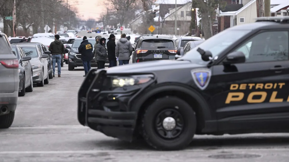 Detroit Police, Michigan State Police, and ATF agents work the scene at West McNichols and Log Cabin in Detroit on the border of Highland Park, Mich., on Feb. 2, 2023. (Robin Buckson/Detroit News via AP)
