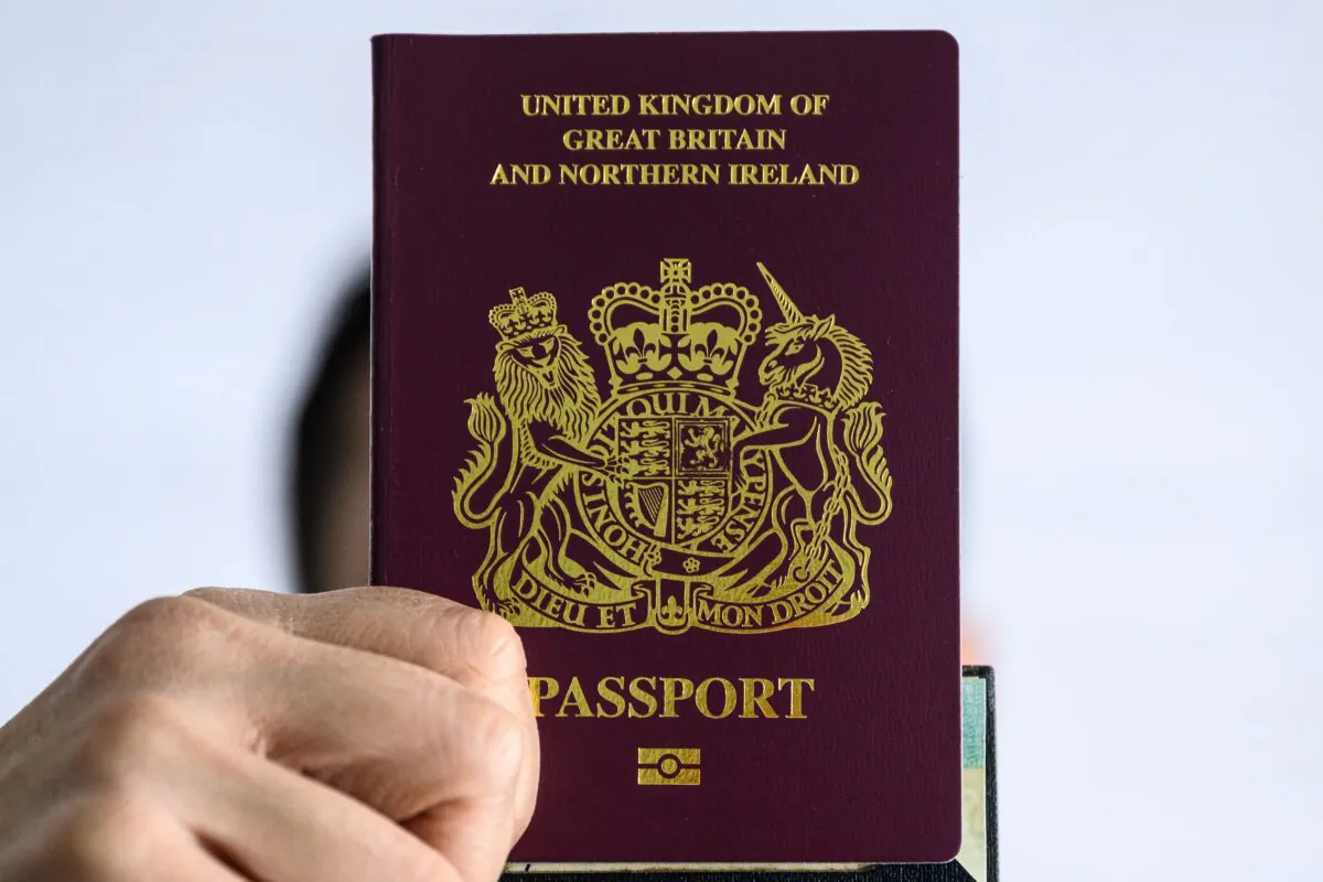 A person holds up a British National (Overseas) passport in Hong Kong on Jan. 29, 2021. (Anthony Wallace/AFP via Getty Images)