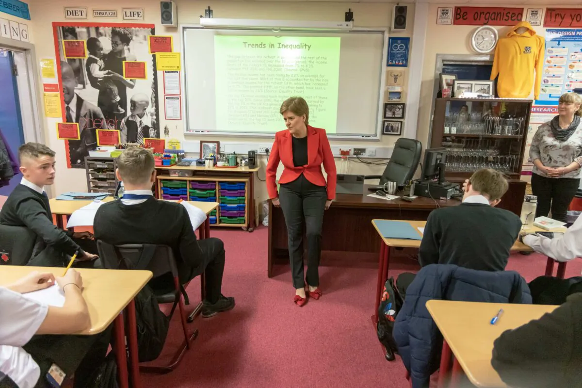 First Minister Nicola Sturgeon chatting to pupils in a Modern Studies class in Glasgow, Scotland, on Nov. 14, 2022. (Robert Perry - Pool/Getty Images)