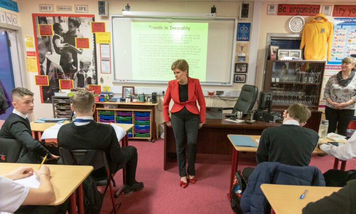 First Minister Nicola Sturgeon chatting to pupils in a Modern Studies class in Glasgow, Scotland, on Nov. 14, 2022. (Robert Perry - Pool/Getty Images)