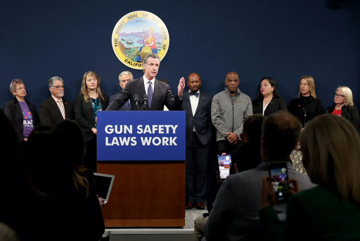 California Gov. Gavin Newsom at a press conference in Sacramento on Feb. 1, 2023, announcing a new law to establish stricter standards for concealed carry weapon permit holders to carry a firearm in public. (Justin Sullivan/Getty Images)