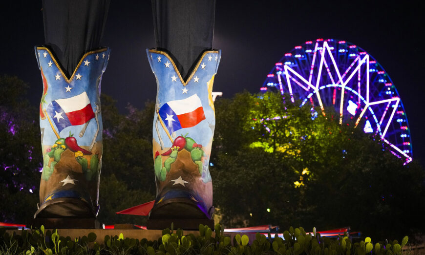 The Texas Star is seen behind the size 96 Lucchese boots of Big Tex on opening night at the State Fair of Texas on Friday, Sept. 30, 2022, in Dallas. (Smiley N. Pool/The Dallas Morning News/TNS)