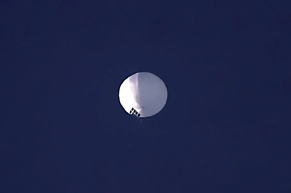 A high-altitude balloon floats over Billings, Montana, on Feb. 1, 2023. The U.S. is tracking a suspected Chinese surveillance balloon that has been spotted over American airspace. The Pentagon would not confirm that the balloon in the photo is the surveillance balloon. (Larry Mayer/The Billings Gazette via AP)