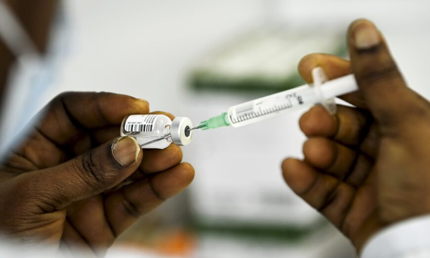 A health worker fills a syringe with a Pfizer-BioNTech COVID-19 vaccine in Finland in a file image. (Emmi Korhonen/Lehtikuva/AFP via Getty Images)