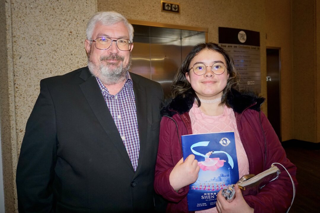 Percussionist Greg Jones and his daughter at Shen Yun Performing Arts at the Tennessee Performing Arts Center, on Feb. 3, 2023. (Yawen Hung/The Epoch Times)