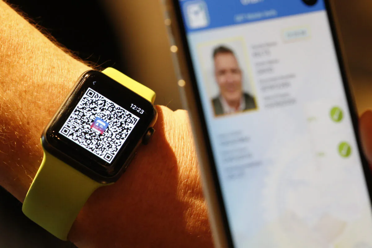 A person scans a QR code on an Apple Watch to temporarily send their digital driver's license to another mobile phone at a Harmons Grocery store in Salt Lake City, Utah, on Aug. 4, 2021. (George Frey/Getty Images)