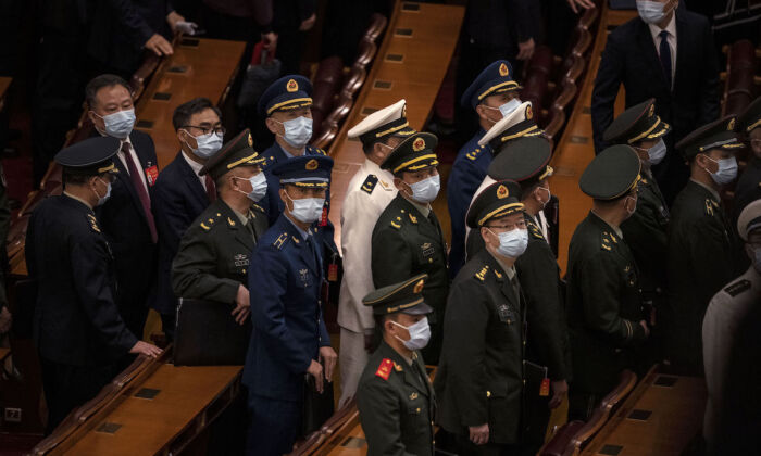 Chinese military delegates leave the closing session of the 20th National Congress of the Communist Party of China, at The Great Hall of People on October 22, 2022 in Beijing, China. (Kevin Frayer/Getty Images)