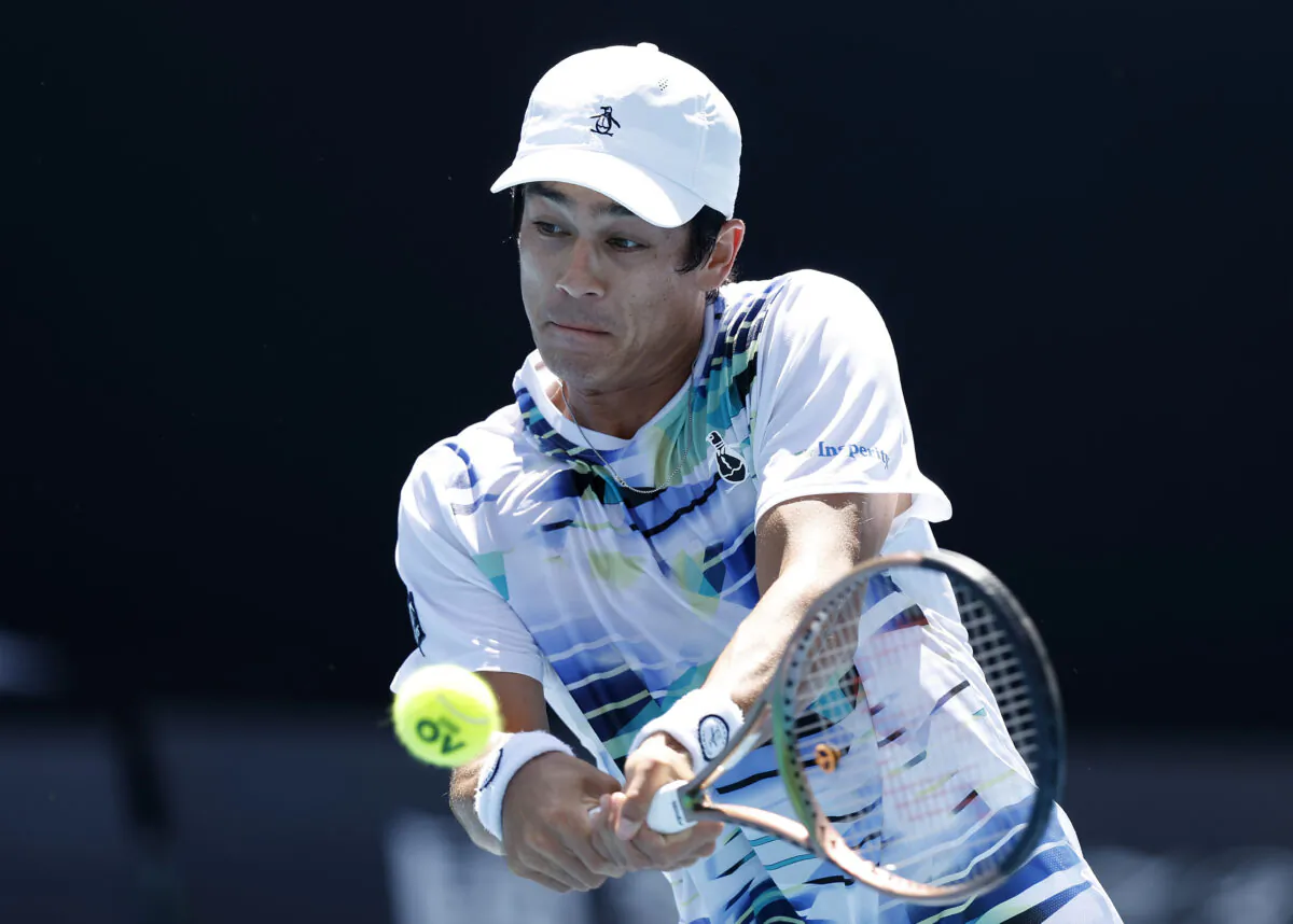 Mackenzie McDonald of the United States plays a backhand during the third round singles match against Yoshihito Nishioka of Japan during day five of the 2023 Australian Open at Melbourne Park in Melbourne, Australia, on Jan. 20, 2023. (Darrian Traynor/Getty Images)