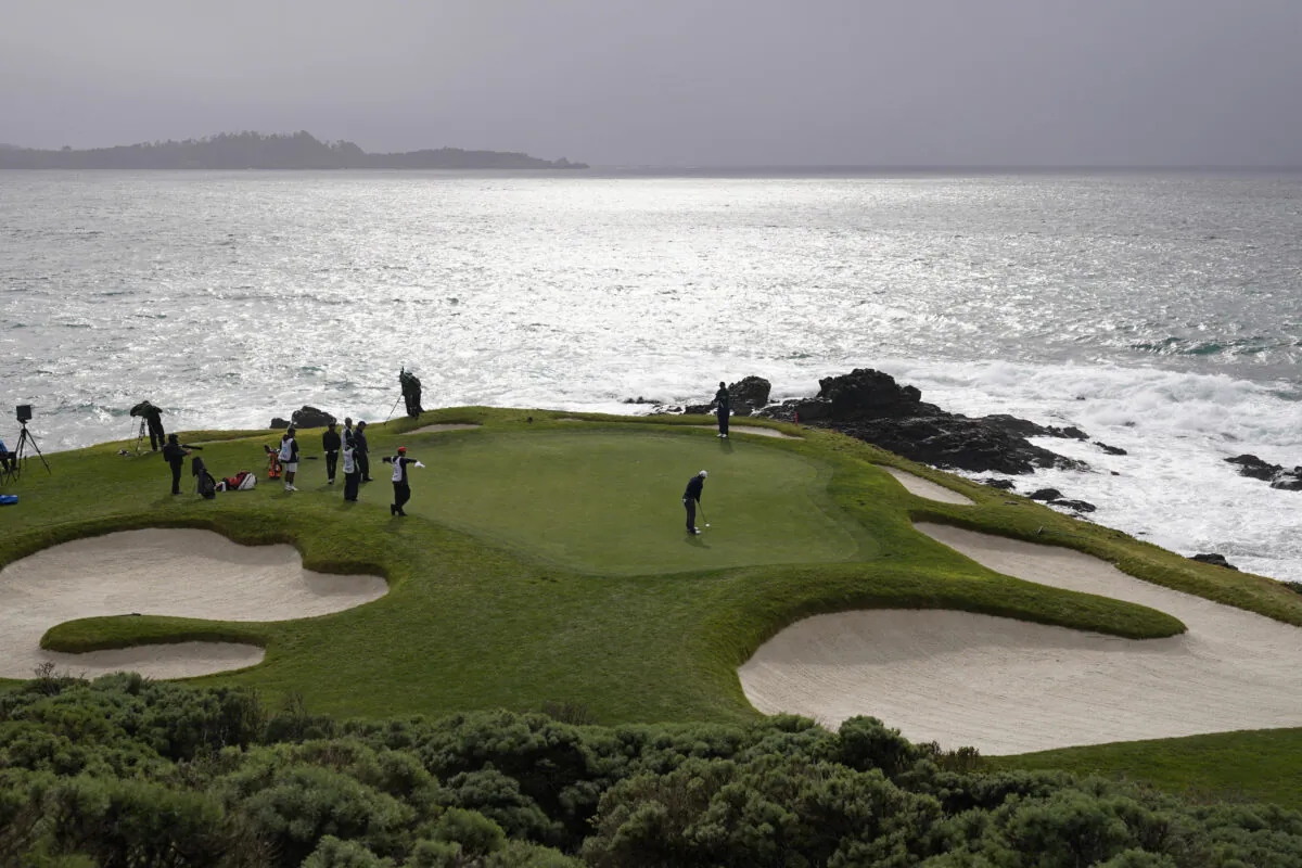 Kurt Kitayama follows his putt on the seventh green of the Pebble Beach Golf Links during the second round of the AT&T Pebble Beach Pro-Am golf tournament in Pebble Beach, Calif., on Feb. 3, 2023. (Eric Risberg/AP Photo)