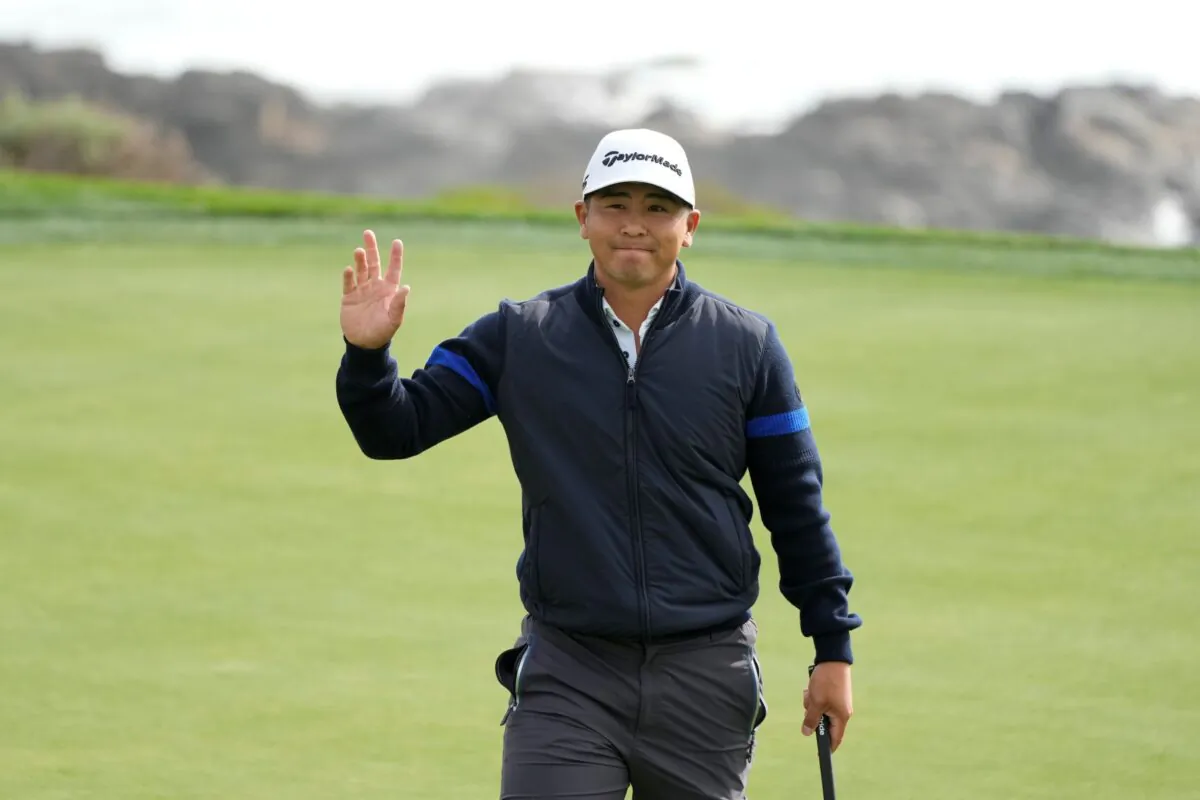Kurt Kitayama waves after making a birdie putt on the eighth green of the Pebble Beach Golf Links during the second round of the AT&T Pebble Beach Pro-Am golf tournament in Pebble Beach, Calif., on Feb. 3, 2023. (Eric Risberg/AP Photo)