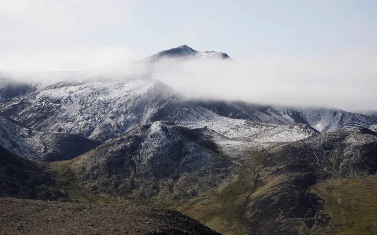 Snow-covered hills in the Porcupine River Tundra in the Yukon Territories, Canada, on Aug. 12, 2009. (Rick Bowmer/AP Photo)