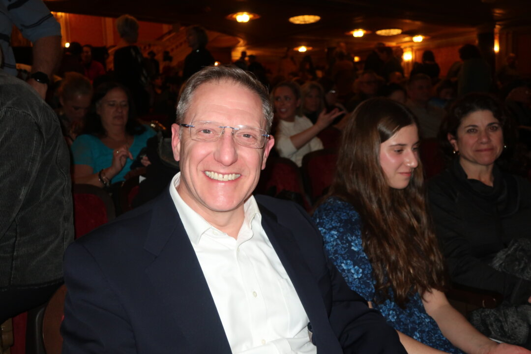 Dr. Eric Dudenhoefer with his family members at Shen Yun Performing Arts at The State Theatre at Playhouse Square, on Feb. 4, 2023. (Stacey Tang/The Epoch Times)