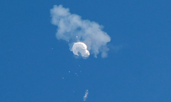 The suspected Chinese spy balloon drifts to the ocean after being shot down off the coast in Surfside Beach, S.C., on Feb. 4, 2023.  (Reuters/Randall Hill)