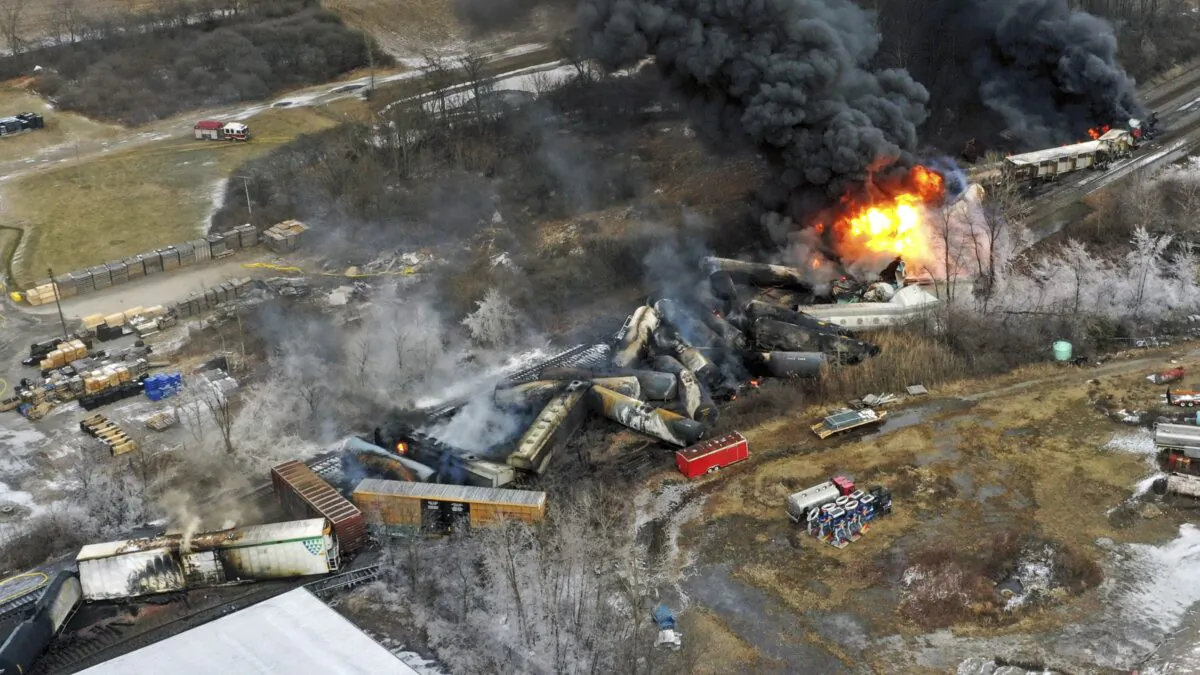 Portions of a Norfolk Southern freight train that derailed Friday night in East Palestine, Ohio, are still on fire at midday, on Feb. 4, 2023. (Gene J. Puskar/AP Photo)