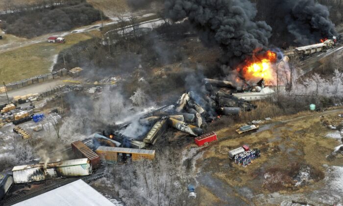 Portions of a Norfolk and Southern freight train that derailed Friday night in East Palestine, Ohio, are still on fire at mid-day, on Feb. 4, 2023. (Gene J. Puskar/AP Photo)