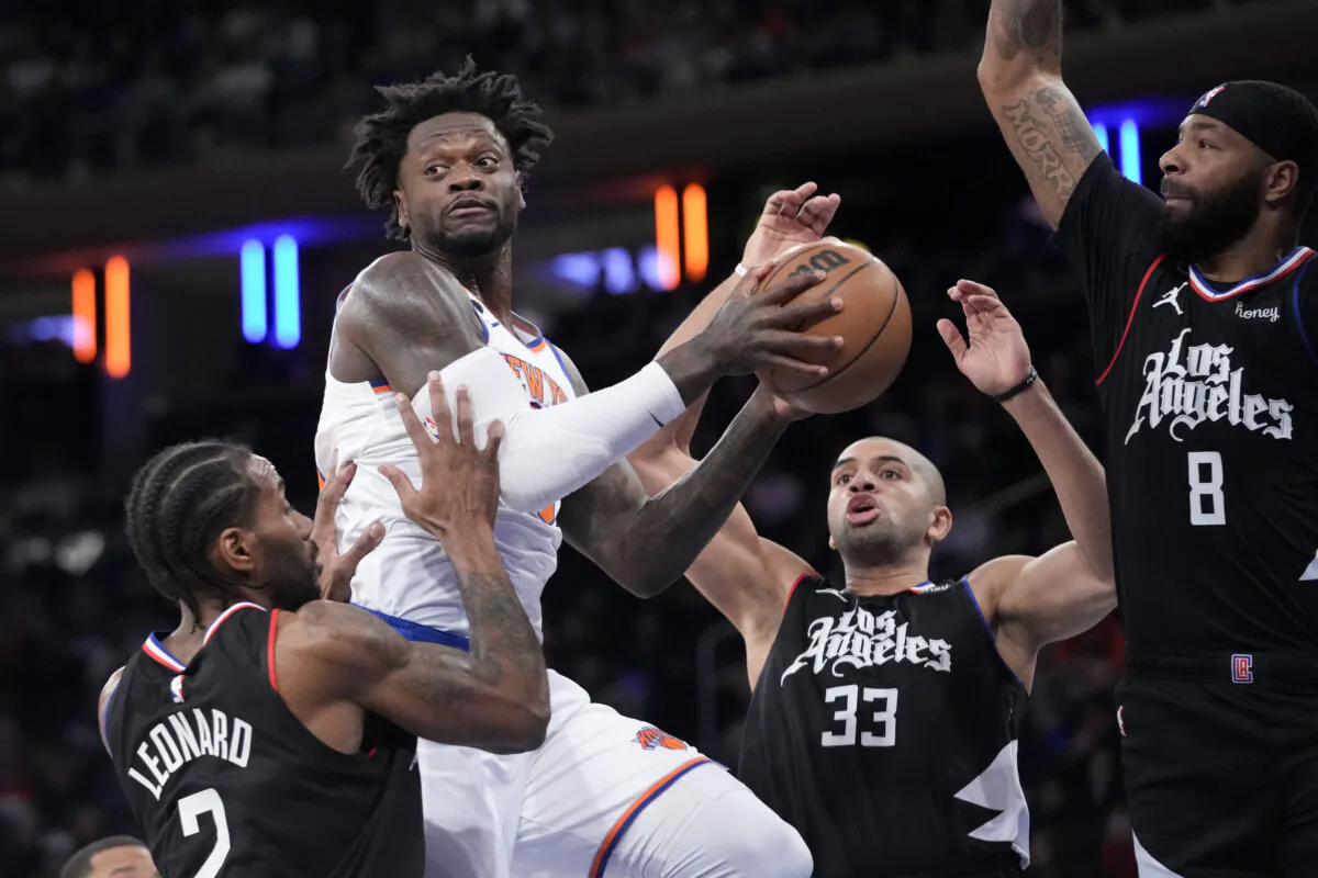 Los Angeles Clippers forwards Kawhi Leonard (2), Nicolas Batum (33) and Marcus Morris Sr. (8) guard against New York Knicks forward Julius Randle, second from left, in the first half of an NBA basketball game at Madison Square Garden in New York on Feb. 4, 2023. (Mary Altaffer/AP Photo)