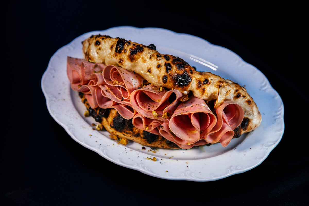 La Mortazza is a kind of folded over pizza sandwich, with mortadella, an Italian meat, on the menu at Mother Wolf in Los Angeles. (Mel Melcon/Los Angeles Times/TNS)