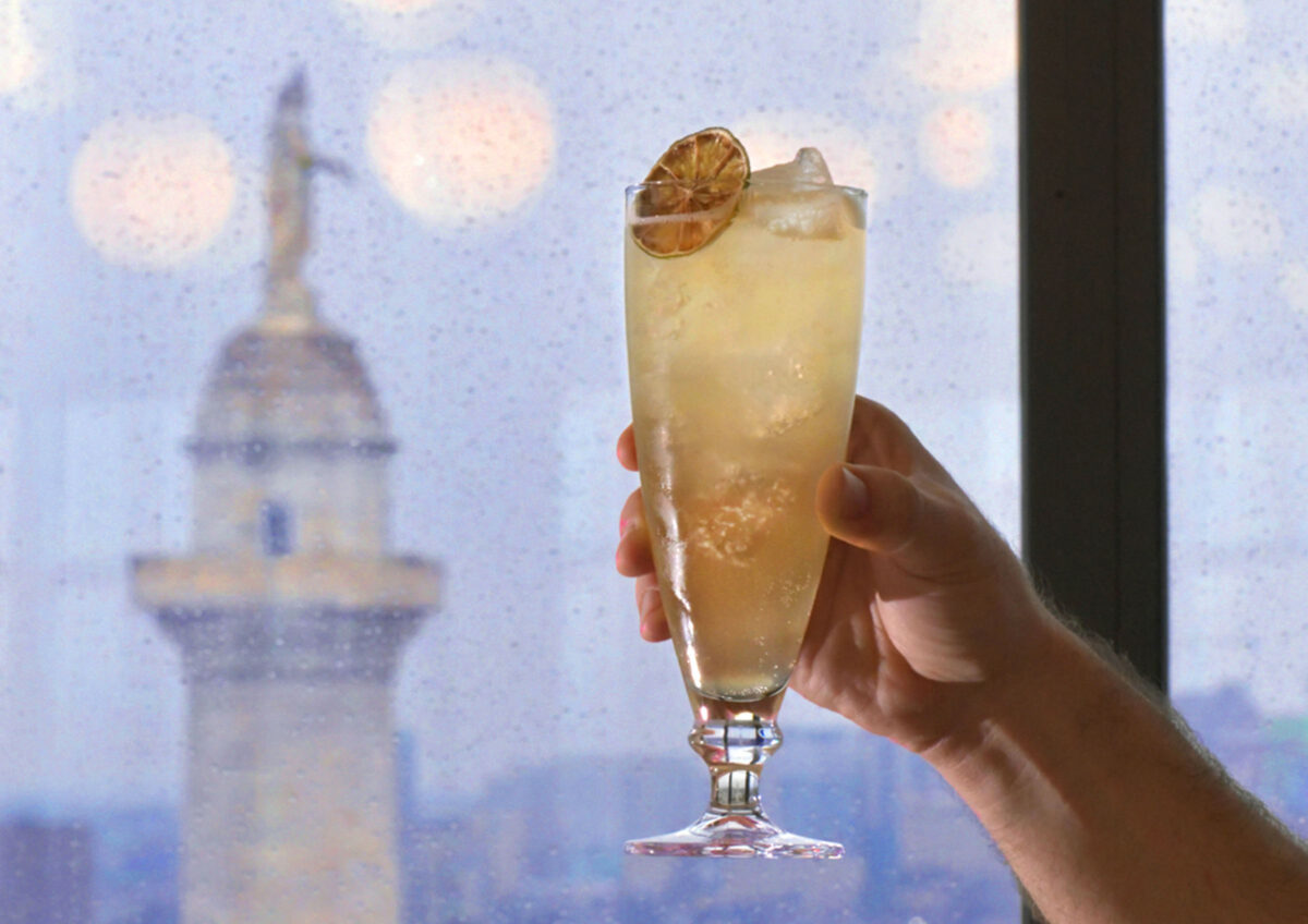 Bartender Christian Parent hoists a spirit-free drink called "Dorothy in the Daytime" at Topside, a restaurant bar on the top floor of Hotel Revival with a fine view of the Washington Monument. (Amy Davis/The Baltimore Sun/TNS)
