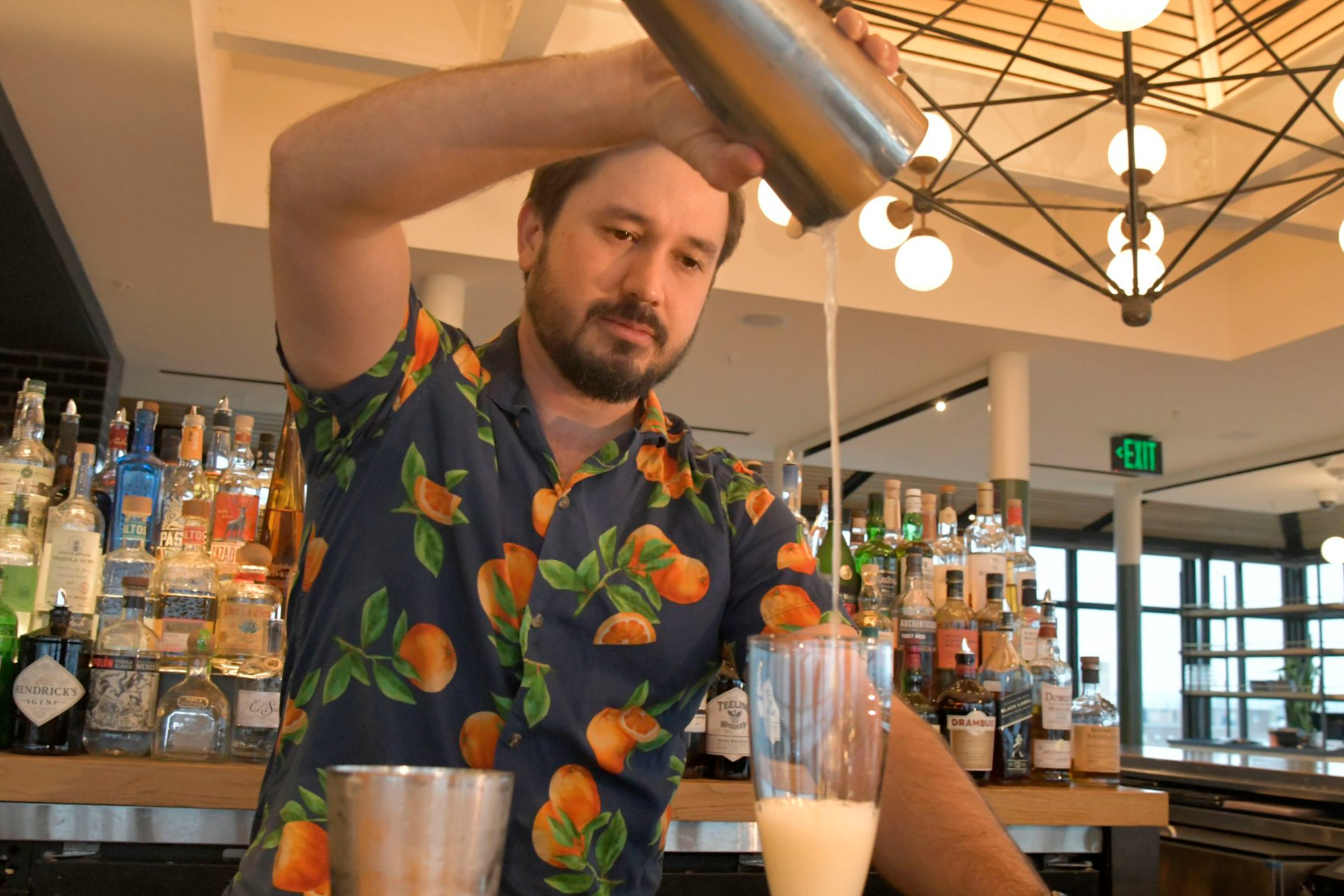 Bartender Christian Parent mixes a spirit-free drink called "Dorothy in the Daytime" at Topside, a restaurant bar on the top floor of Hotel Revival in Mount Vernon.