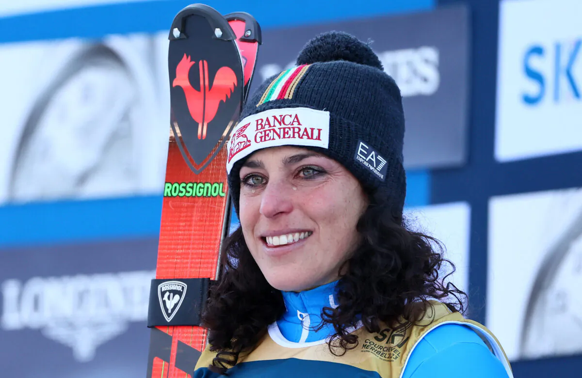 Italy's Federica Brignone celebrates on the podium after winning the Women's Alpine Combined at the Alpine Skiing FIS Alpine Ski World Cup-Women's Alpine Combined in Meribel, France, on Feb. 6, 2023. (Denis Balibouse/Reuters)
