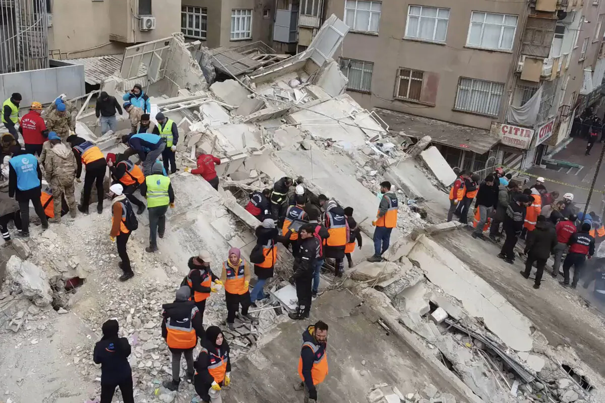 Rescuers search for survivors through the rubble in Sanliurfa, after a 7.8-magnitude earthquake struck the Turkey's southeast on Feb. 6, 2023. (STR/AFP via Getty Images)