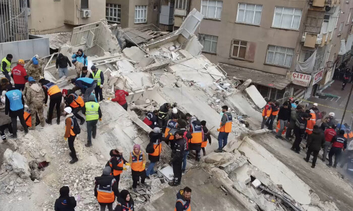 Rescuers search for survivors through the rubble in Sanliurfa, after a 7.8-magnitude earthquake struck the Turkey's southeast on Feb. 6, 2023. (STR/AFP via Getty Images)