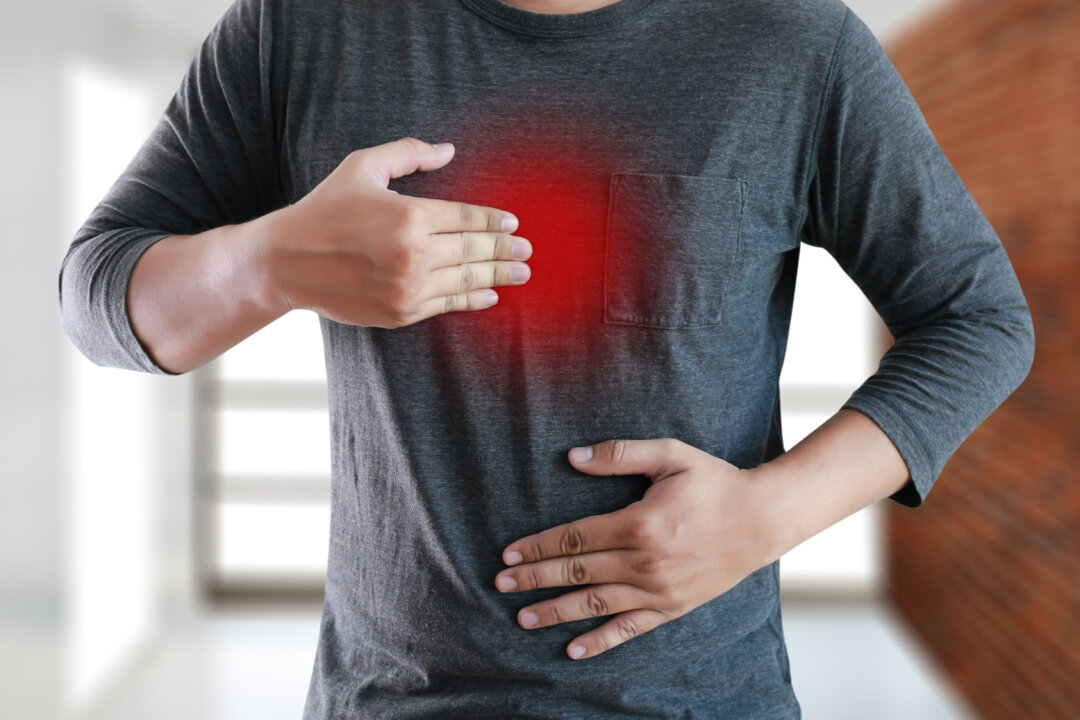 Man suffering from acid reflux. (Shutterstock)