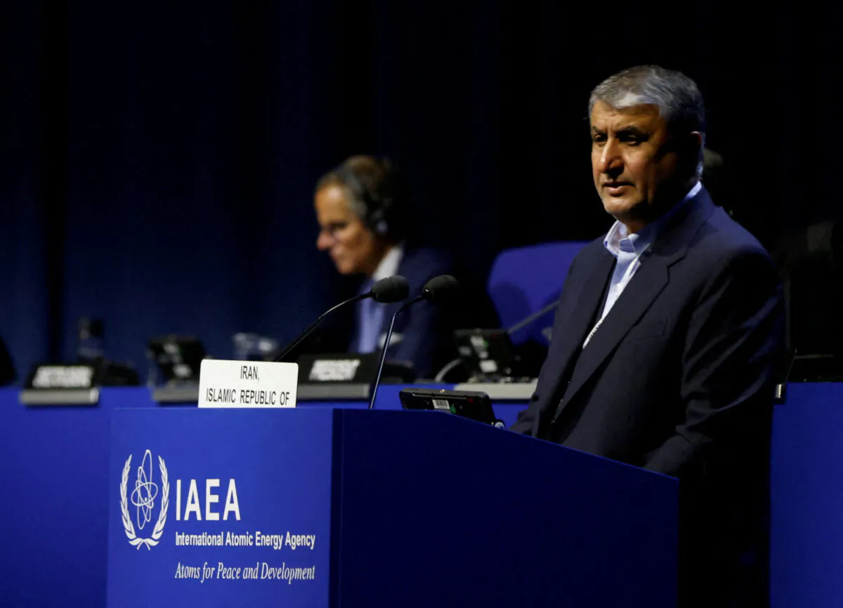 Head of Atomic Energy Organization of Iran Mohammad Eslami and International Atomic Energy Agency Director General Rafael Grossi attend the opening of the IAEA General Conference at their headquarters in Vienna, Austria, on Sept. 26, 2022. (Leonhard Foeger/Reuters)